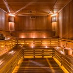 brand new sauna with lots of candles, towels and wooden bucket
